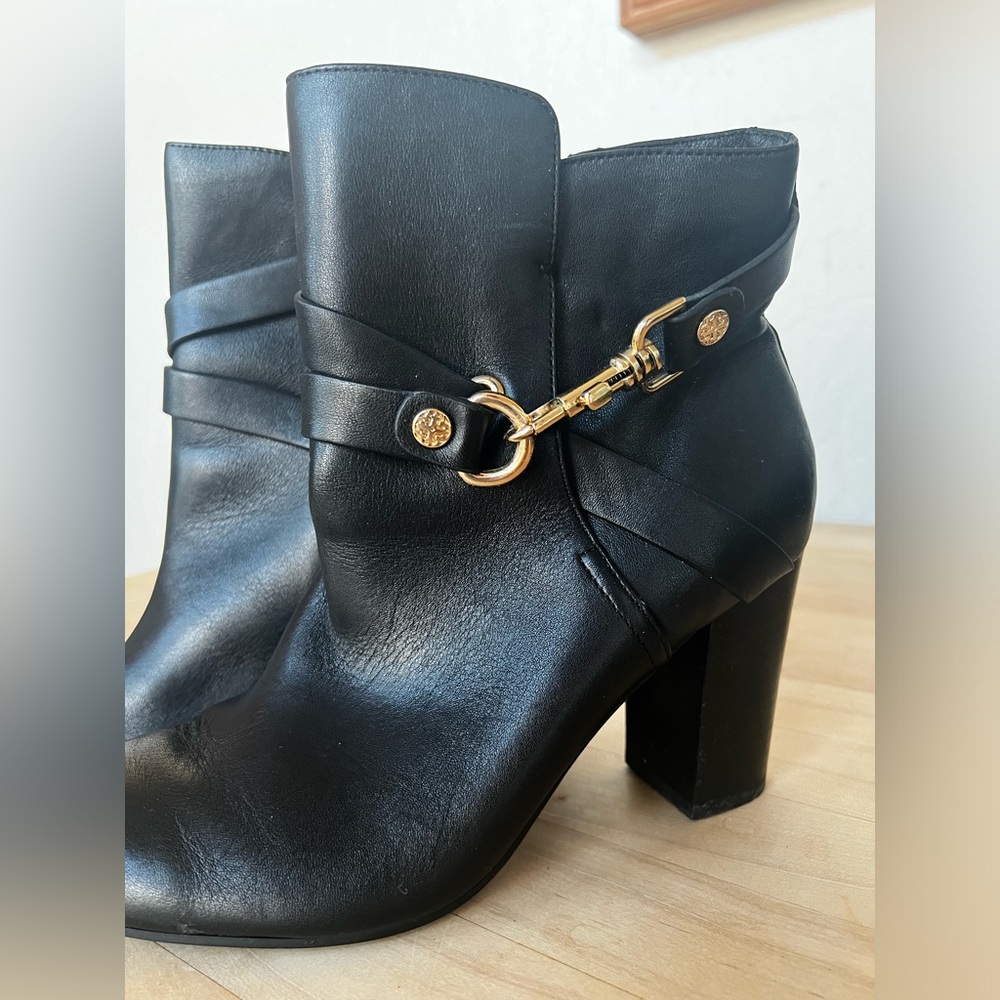 Black leather bootie with gold buckle
